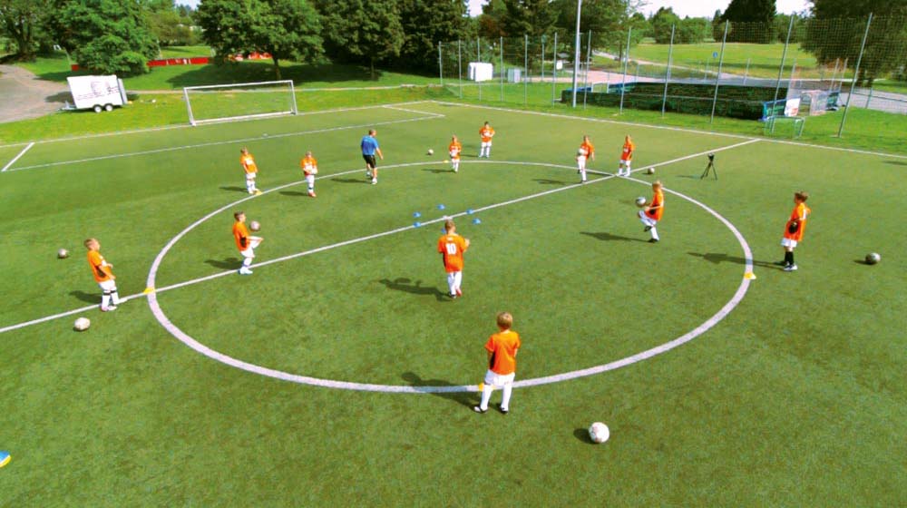 A circle of cones is positioned in the middle to simulate a group of defenders